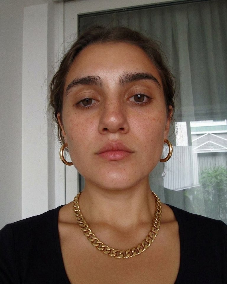 Gold · Warm: gold lifts, silver sits cold against the skin.